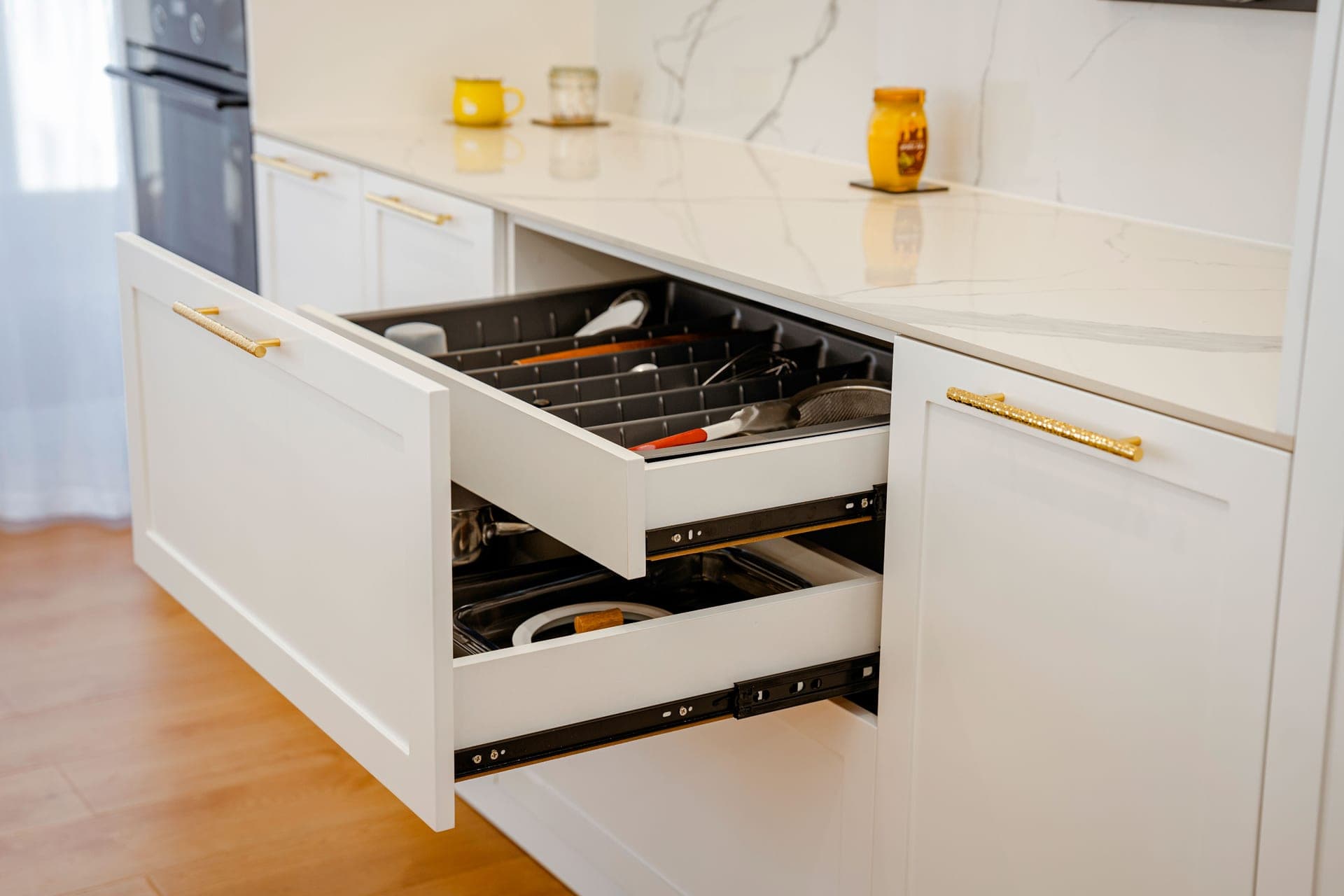A run of kitchen drawers with metal handles