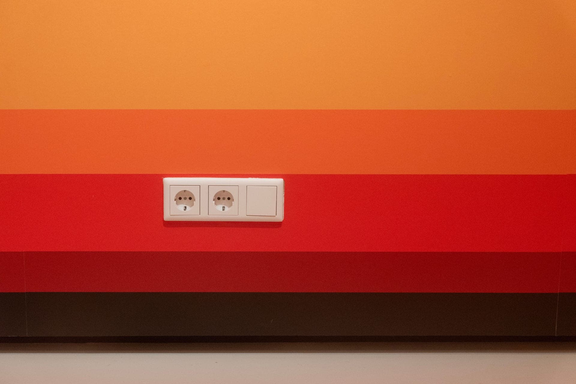 Assorted childproofing latches and covers laid out on a table