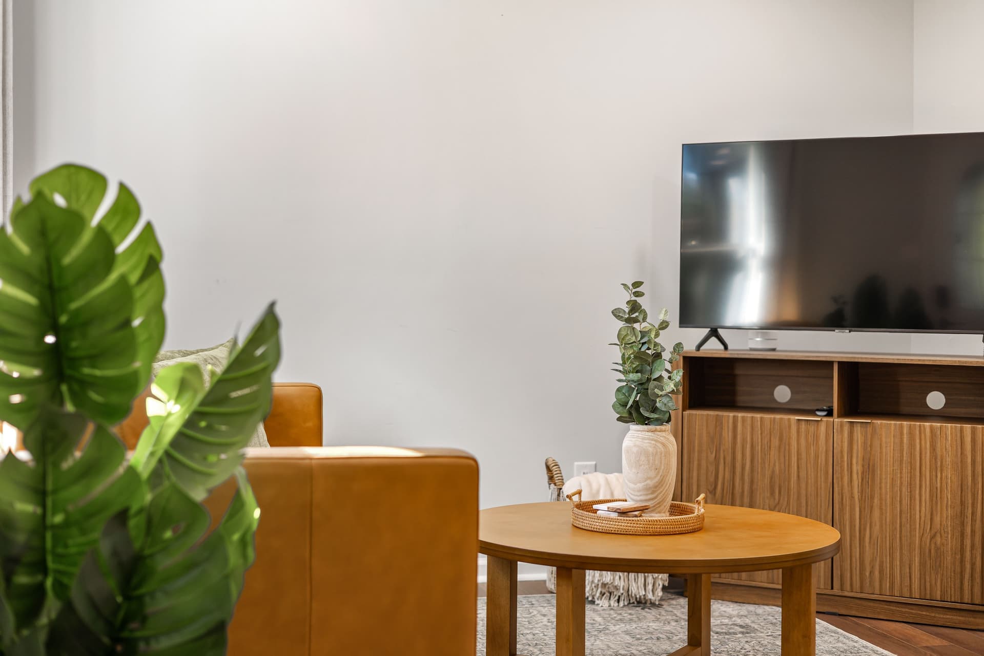 A flat-screen television on a low media stand